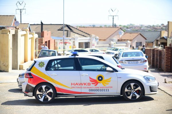 Two Hawks officers arrested for theft, money laundering and other charges