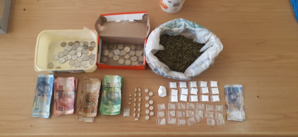 Two behind bars as police confiscate drugs and counterfeit money