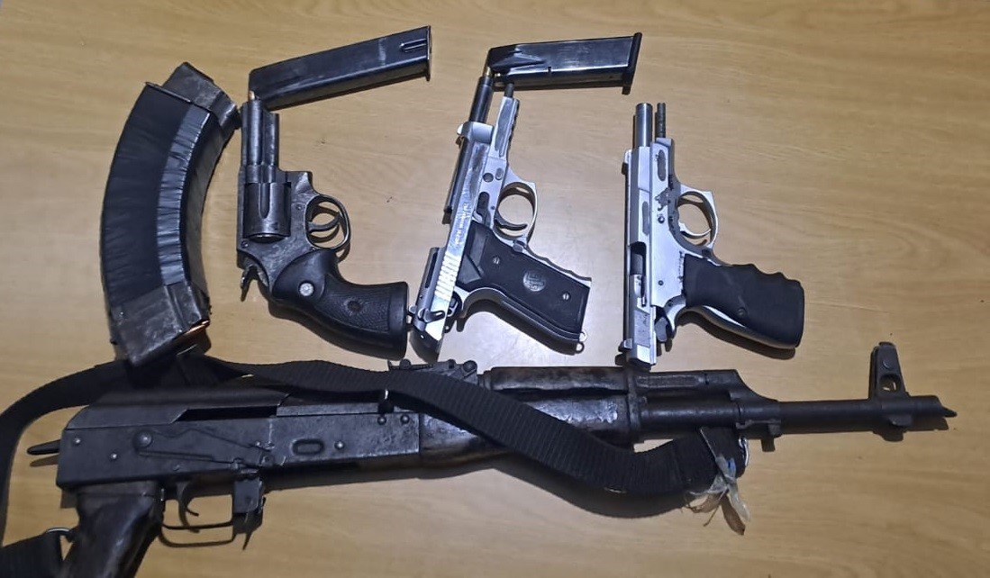 Wanted suspects nabbed with firearms