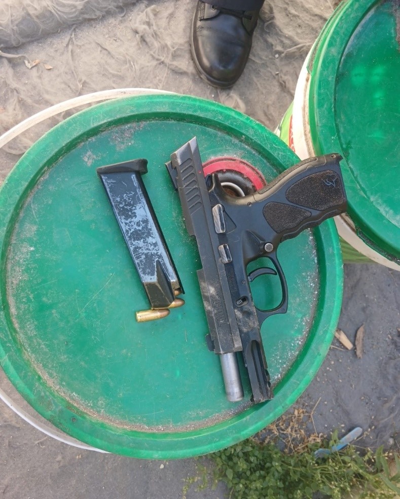 Police detain two suspects for possession of an unlicensed firearm and ammunition